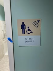ADA Shower Sign with Braille, Tactile Letters and Pictograms