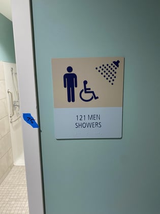 ADA Shower Sign with Braille, Tactile Letters and Pictograms
