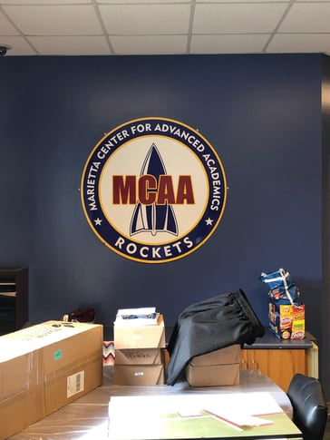 Logo Sign MCAA interior sign branding