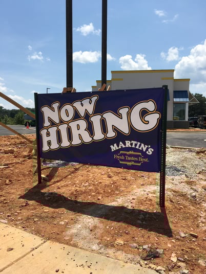 Temporary restaurant hiring sign example showing Now Hiring promotional signage for Martin's in metro Atlanta