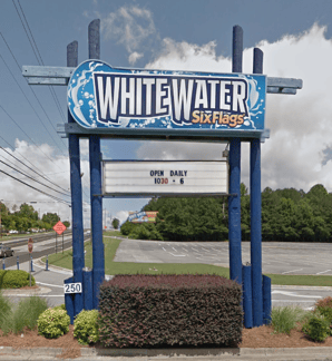 White Water Six Flags entrance sign with changeable message board displaying hours, custom monument sign by Signs & More in Atlanta Georgia