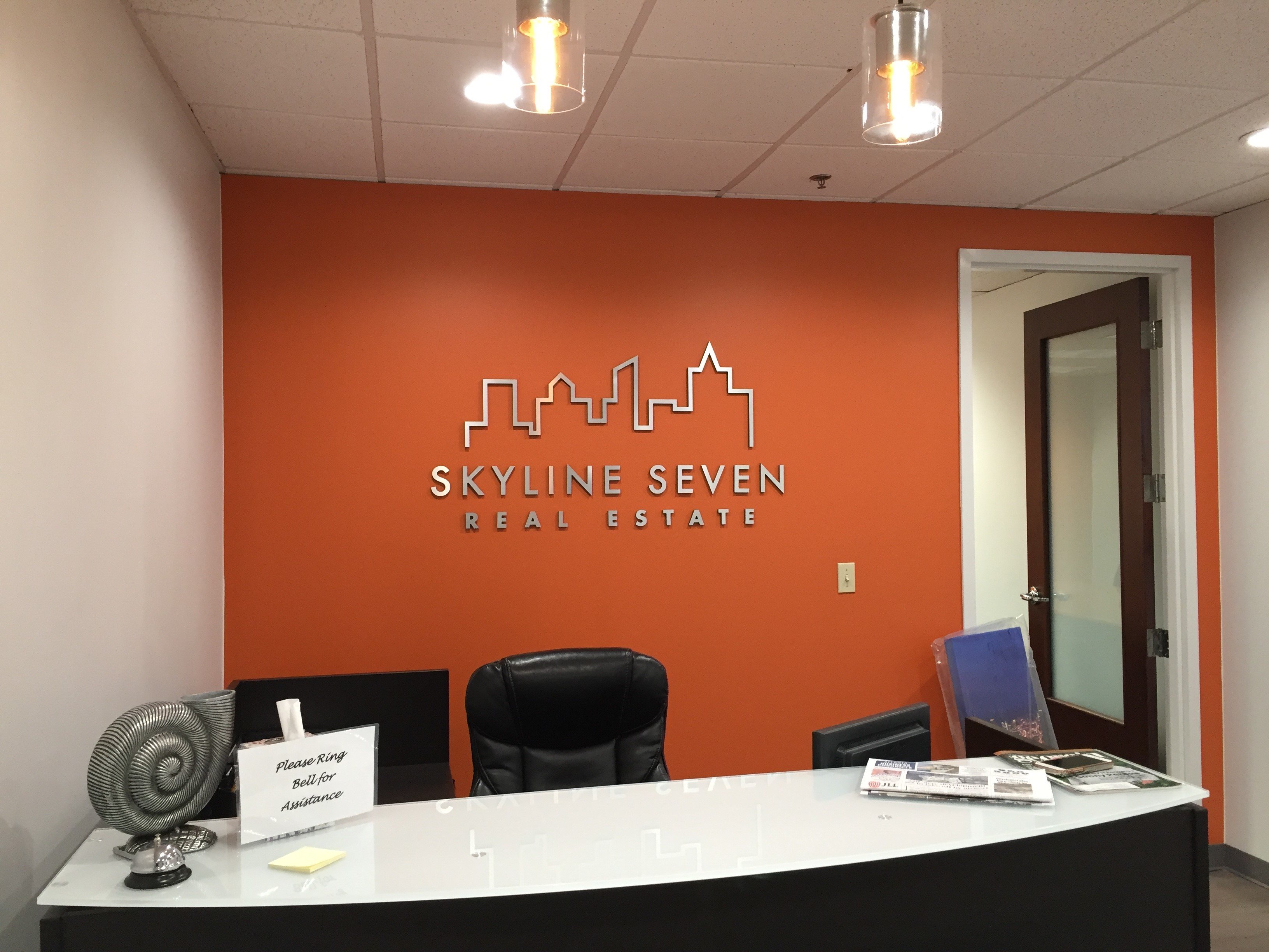 Skyline Seven Real Estate, lobby sign, office lobby signage, custom lobby  signs, reception signs for business, attractive reception sign