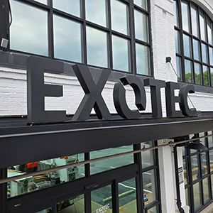 Custom matte-black channel letters, bottom-mounted exterior building sign installed by Marietta Signs in Atlanta, GA